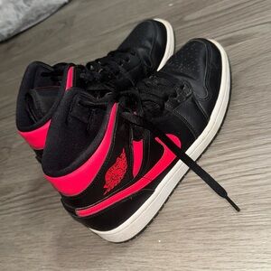 Black and pink Jordan 1s